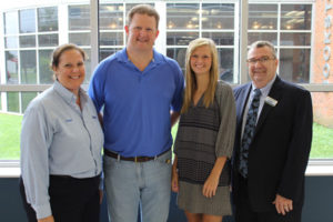 Pictured (l-r) ) Kristal DiCarlo, Human Resources Manager at AGC Automotive and Chair of the EIFTC Board; Christopher Pierce, Sarah Pierce, Dr. Tom Davenport, ECTC Dean of Workforce Solutions