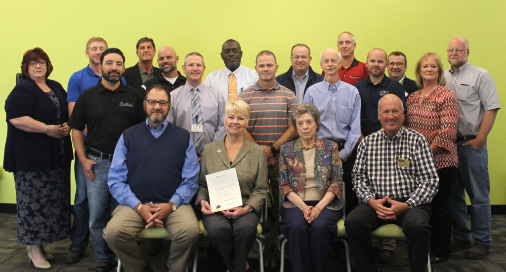 Elizabethtown Mayor Edna Berger proclaims October Manufacturing Month in Elizabethtown during a gathering at the Elizabethtown-Hardin County Industrial Foundation on Thursday.